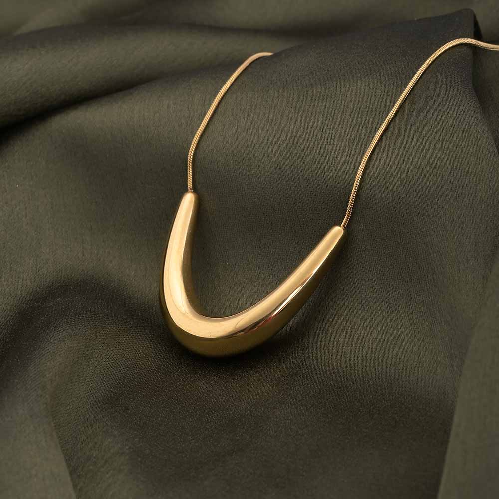 Golden boomerang necklace