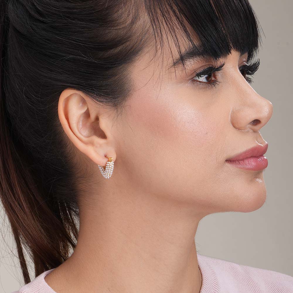 Heart shapped pearl hoop earrings